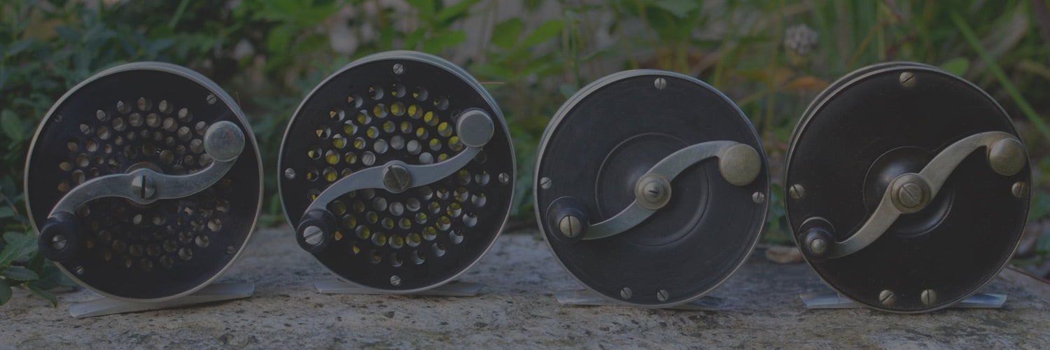 A fine S.E. Bogdan Baby Bogdan Small Trout 3wt left hand wind trout fly reel,  the 2 ¾ reel with black anodised end plates, counter-balanced serpentine  crank wind handle. ventilated front drum
